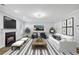 Inviting living room with fireplace, stylish furniture, and decorative accents at 277 Edison Dr, Stockbridge, GA 30281