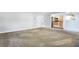 Spacious living room showing doorway into the kitchen at 277 Edison Dr, Stockbridge, GA 30281