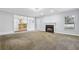 Spacious living room with fireplace and view to the kitchen at 277 Edison Dr, Stockbridge, GA 30281