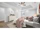 Serene main bedroom with a tray ceiling, carpet, and comfortable furnishings at 277 Edison Dr, Stockbridge, GA 30281
