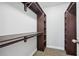 Walk-in closet with carpeted floors and shelving to maximize storage at 277 Edison Dr, Stockbridge, GA 30281