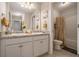 Bathroom featuring double sinks, granite countertop, and a bath/shower combo at 353 Daffodil Dr, Temple, GA 30179
