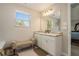 Bright bathroom with double vanity, granite counters, and access to the main bedroom at 353 Daffodil Dr, Temple, GA 30179