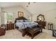 Spacious bedroom featuring vaulted ceilings, classic furniture, and natural light at 353 Daffodil Dr, Temple, GA 30179
