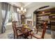 Charming dining room featuring a wooden table, chandelier lighting, and decorative accents at 353 Daffodil Dr, Temple, GA 30179