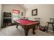 Game room with a pool table, bar area, and seating perfect for entertaining at 353 Daffodil Dr, Temple, GA 30179