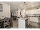Modern kitchen with white cabinets, stainless steel appliances, granite counters, and an island with bar seating at 353 Daffodil Dr, Temple, GA 30179