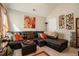 Comfortable living room featuring a sectional couch with throw pillows and natural light at 353 Daffodil Dr, Temple, GA 30179
