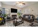 Comfortable living room with a fireplace, large TV, and easy access to the kitchen area at 353 Daffodil Dr, Temple, GA 30179