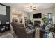Cozy living room with a fireplace, neutral decor, and seamless flow into the adjacent kitchen at 353 Daffodil Dr, Temple, GA 30179