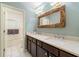 Well-appointed bathroom with double sinks, modern mirror and plenty of countertop space at 405 Ballymore Pass, Woodstock, GA 30189
