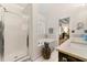 Bright bathroom featuring a walk-in shower, soaking tub, and marble countertops at 405 Ballymore Pass, Woodstock, GA 30189