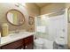 Charming bathroom with vanity, round mirror, and a glass shower enclosure at 405 Ballymore Pass, Woodstock, GA 30189