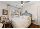 Cozy bedroom featuring a plush bed, soft linens, and natural light at 405 Ballymore Pass, Woodstock, GA 30189