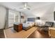 Comfortable bedroom with a full bed, chair and side table with natural light from windows at 405 Ballymore Pass, Woodstock, GA 30189