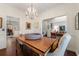 Elegant dining room with chandelier and seamless access to adjacent rooms at 405 Ballymore Pass, Woodstock, GA 30189