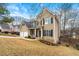 Charming two-story home with a well-manicured front yard and inviting entrance at 405 Ballymore Pass, Woodstock, GA 30189