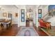 Inviting hallway showcasing hardwood floors, elegant decor, and open layout at 405 Ballymore Pass, Woodstock, GA 30189