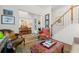 Open hallway with hardwood floors, elegant decor, and staircase at 405 Ballymore Pass, Woodstock, GA 30189