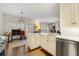 Bright kitchen with island, white cabinetry, and stainless steel appliances at 405 Ballymore Pass, Woodstock, GA 30189