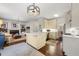Open-concept kitchen with island, white cabinetry, and stainless steel appliances at 405 Ballymore Pass, Woodstock, GA 30189