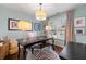 Bright office space with a large window, wooden desk, and modern decor at 405 Ballymore Pass, Woodstock, GA 30189