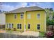 A two-story home with a backyard, patio, and green exterior at 4461 Kentland Dr, Acworth, GA 30101
