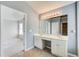 Bathroom with double sinks, white cabinets, and large mirror, adjacent to a bedroom at 4461 Kentland Dr, Acworth, GA 30101