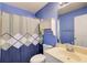 A full bathroom features a shower, toilet, and vanity with sink at 4461 Kentland Dr, Acworth, GA 30101