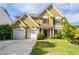 Charming two-story home featuring a well-manicured lawn, two-car garage, and inviting front porch at 4461 Kentland Dr, Acworth, GA 30101