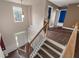 Bright foyer with hardwood floors, staircase, and view to the front door at 4461 Kentland Dr, Acworth, GA 30101