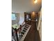 Upstairs hallway with hardwood floors and decorative lighting at 4461 Kentland Dr, Acworth, GA 30101