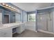 Serene primary bath featuring dual sinks, a soaking tub, and a separate glass shower at 4461 Kentland Dr, Acworth, GA 30101