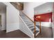 Inviting staircase with hardwood floors, wood railing, and iron spindles leading to the upper level at 4461 Kentland Dr, Acworth, GA 30101