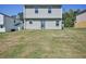A large backyard with a grassy area extends behind the two-story home at 5675 Laurel Ridge Cir, Atlanta, GA 30344