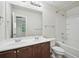 Bathroom with double vanity, tile floors, and combination tub and shower at 5675 Laurel Ridge Cir, Atlanta, GA 30344