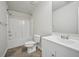 This bathroom features a shower-tub combo, toilet, vanity with sink, and ceramic tile flooring at 5675 Laurel Ridge Cir, Atlanta, GA 30344
