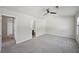 Spacious bedroom features a ceiling fan, neutral paint, and carpet at 5675 Laurel Ridge Cir, Atlanta, GA 30344