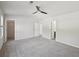 Spacious bedroom featuring a ceiling fan, neutral paint, and carpet at 5675 Laurel Ridge Cir, Atlanta, GA 30344