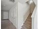 Hallway leading to carpeted stairs and the front door at 5675 Laurel Ridge Cir, Atlanta, GA 30344