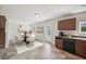 Bright kitchen and dining area featuring tile flooring and modern appliances at 5675 Laurel Ridge Cir, Atlanta, GA 30344