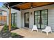 Outdoor patio with sleek chairs, black framed windows, and a wood plank ceiling at 1010 Violet Sw St # A, Atlanta, GA 30310