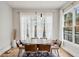 Elegant dining room with modern lighting, large windows, and stylish furniture at 1010 Violet Sw St # A, Atlanta, GA 30310