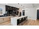 Contemporary kitchen with a large island, black cabinets, and stainless steel appliances at 1010 Violet Sw St # A, Atlanta, GA 30310