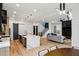 Open concept living space with kitchen island, stairs and modern furniture at 1010 Violet Sw St # A, Atlanta, GA 30310