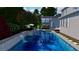 Serene backyard with a sparkling pool, hot tub and screened-in porch perfect for entertaining at 1190 Mosspointe Dr, Roswell, GA 30075