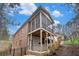 A two-story brick home with a screened-in porch and a hot tub on the lower level deck at 1190 Mosspointe Dr, Roswell, GA 30075