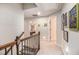 View of the hallway with stairs and decorative paintings on the wall at 1190 Mosspointe Dr, Roswell, GA 30075