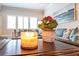 Living room with a cozy sitting area and a decorative candle and plant on the table at 1190 Mosspointe Dr, Roswell, GA 30075