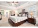 Spacious primary bedroom with a tray ceiling, a sitting area, and an ensuite bathroom at 1190 Mosspointe Dr, Roswell, GA 30075